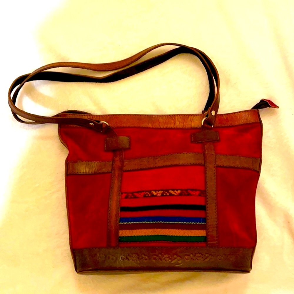 Bolivian deep red, woven, and brown leather classic piece.